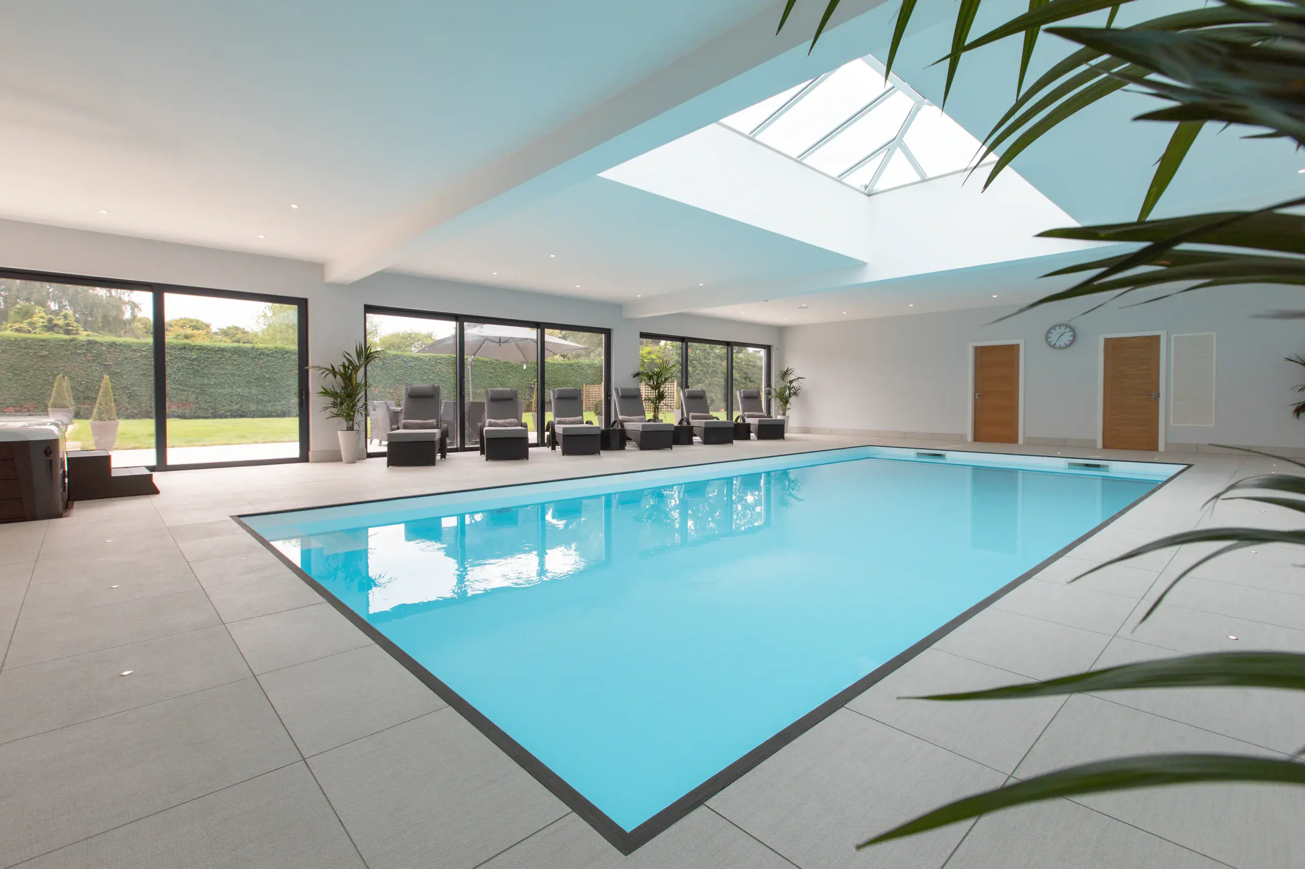 a indoor pool with a skylight