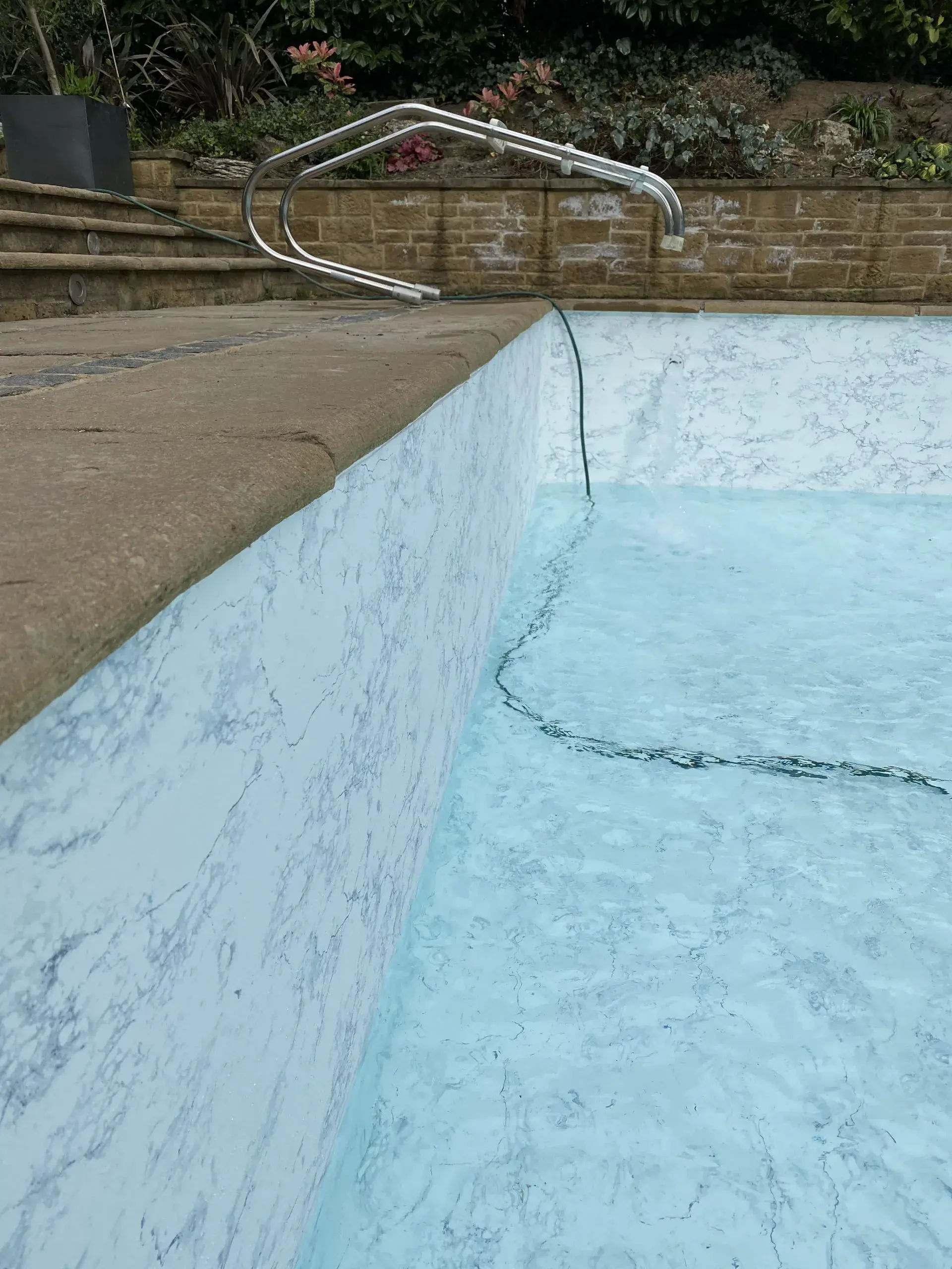 a pool with a hose